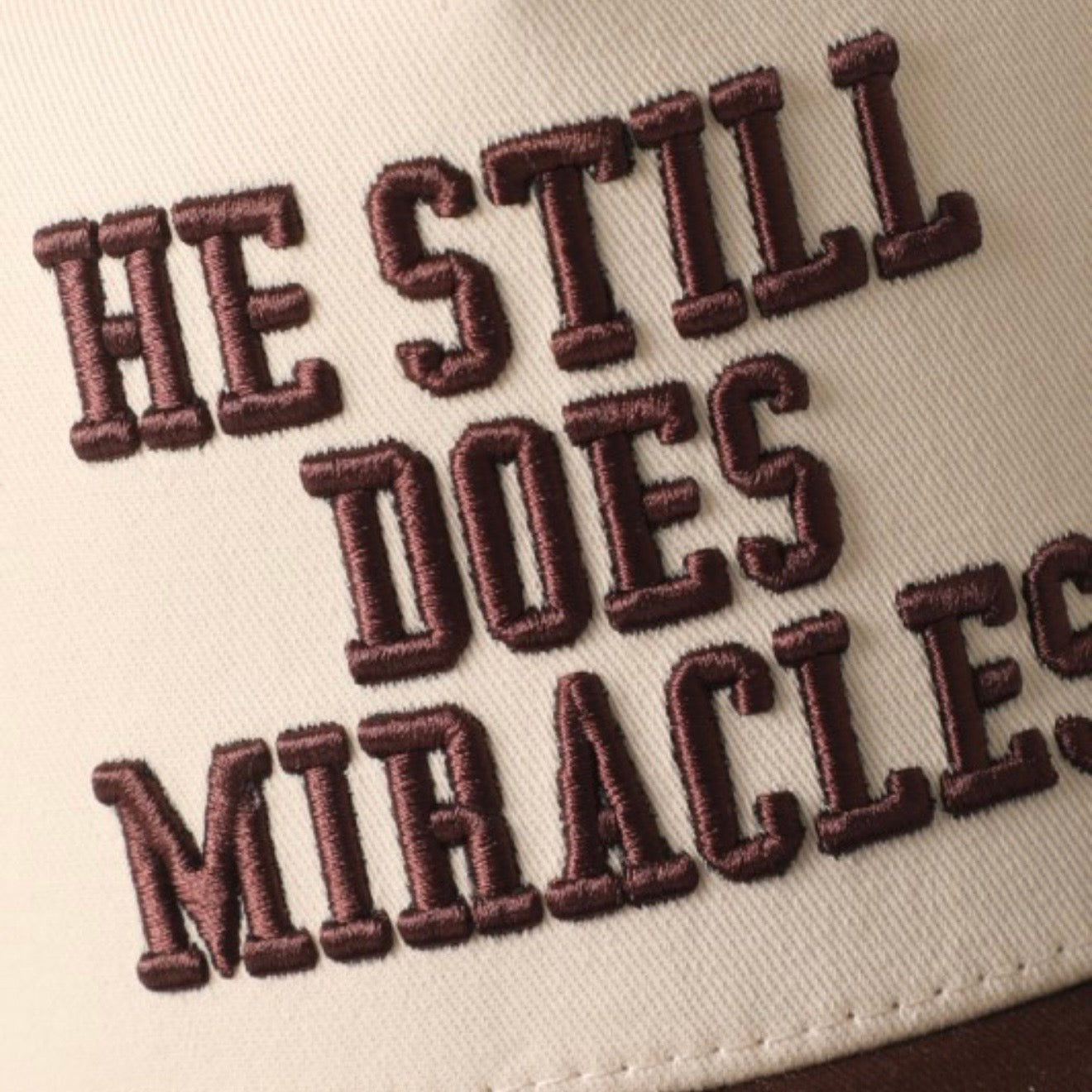 He Still Does Miracles Trucker Hat